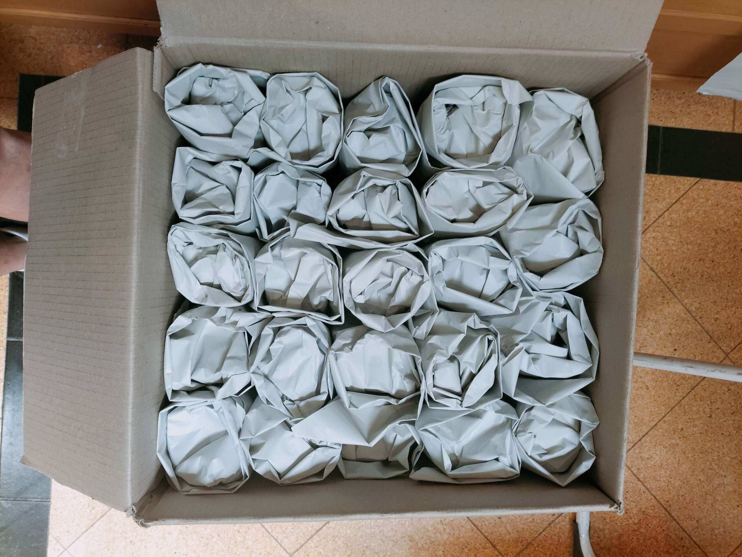 perfectly packed champagne glasses ready for moving house